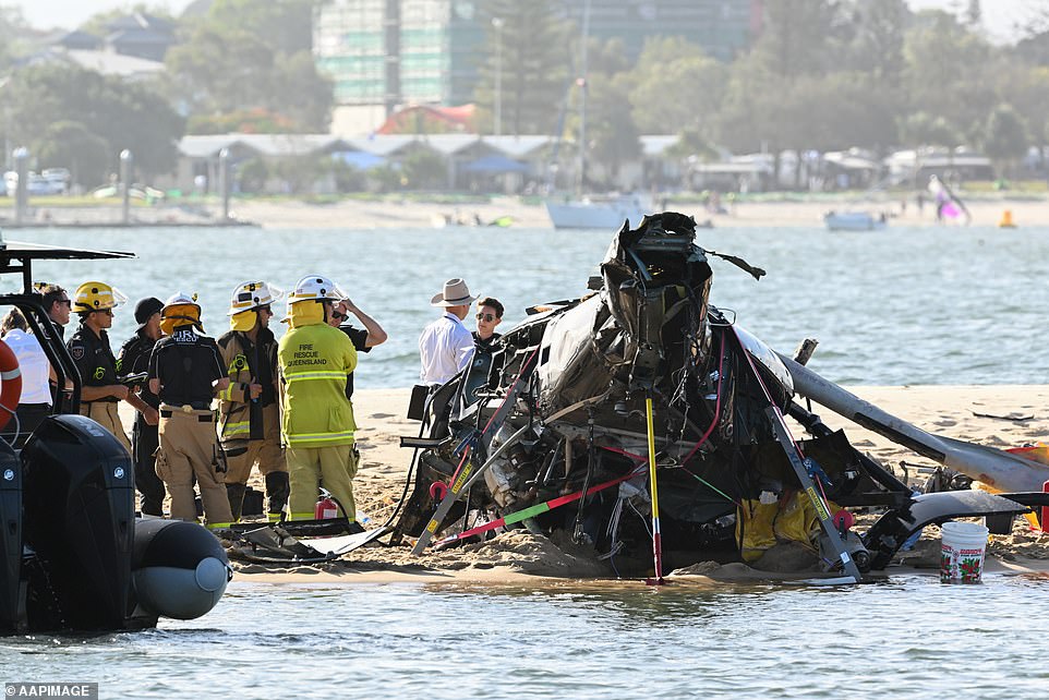 Investigators rush to collect evidence before high tide covers the sandbar.