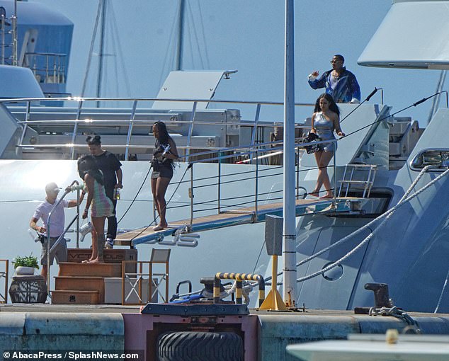 Drenched in the sun: The gang used a steel plank to get off the ship