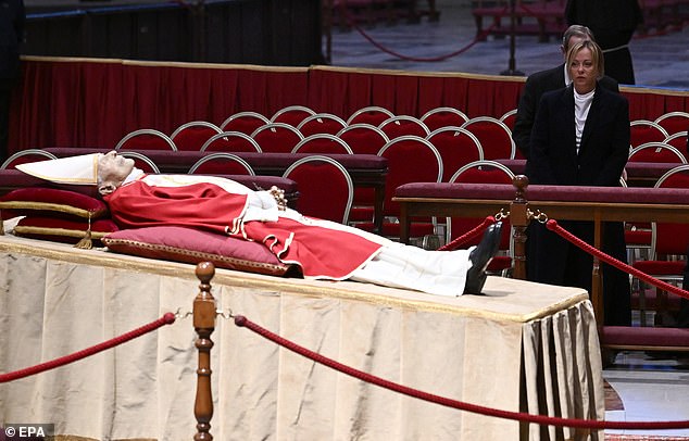 Ms. Meloni was seen paying her respects to Benedict, in St. Peter's Basilica, where he will remain in state for three days.