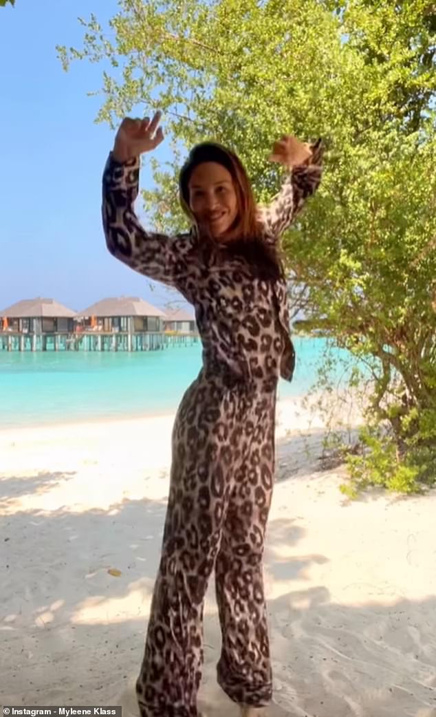 Looks good: Also tried on a matching leopard-print ensemble from her collection at the high street store Next