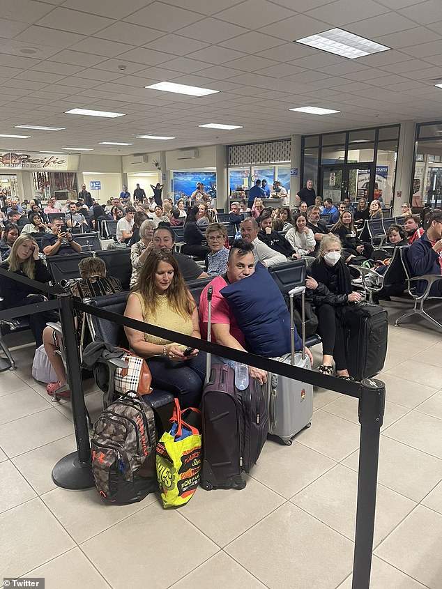 The passengers (pictured Saturday at the Pago Pago airport) were forced to spend almost a full day on the remote island, located between Hawaii and New Zealand.