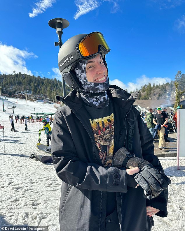 Photo shoot: Jutes smiled toothily as his girlfriend took a photo of him in the snow