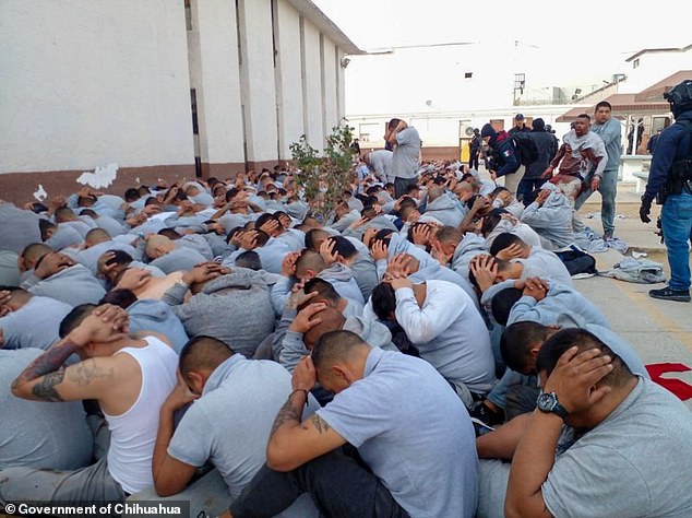 Inmates are detained outside the Cereso No. 3 state prison in Ciudad Juárez after the deadly attack Sunday morning that left 10 guards and seven inmates dead.