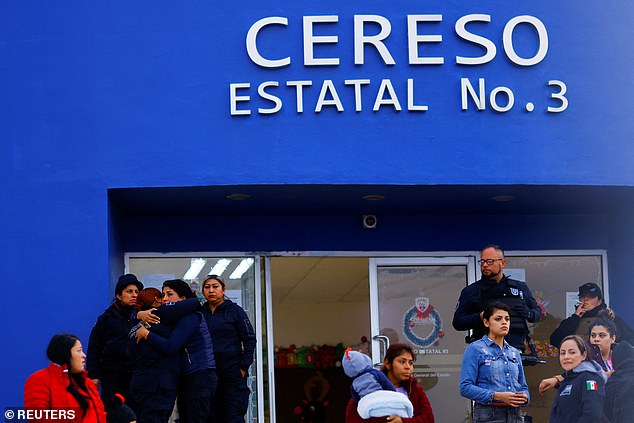 Visitors stand in front of the entrance to Cereso State Prison No. 3 following the Sunday morning assault on the jail that led to the escape of 27 inmates.