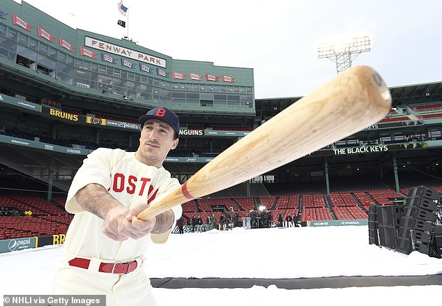 Brad Marchand #63 of the Boston Bruins stands on the field before the Discover NHL Winter Classic 2023 game between the Pittsburgh Penguins and the Boston Bruins at Fenway Park