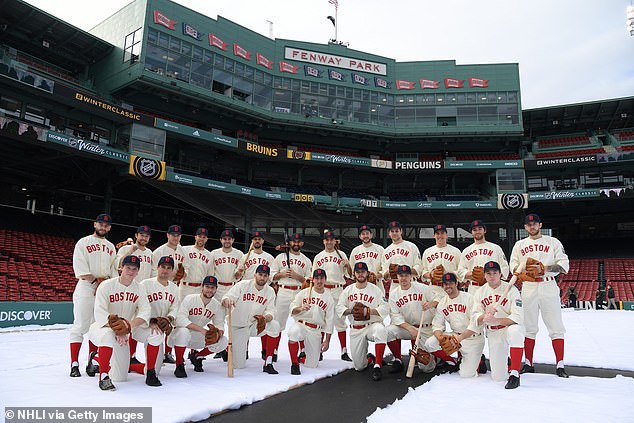 The Boston Bruins pose for a team photo before the game against the Pittsburgh Penguins in the Discover NHL Winter Classic 2023 at Fenway Park on January 2, 2023 in Boston.