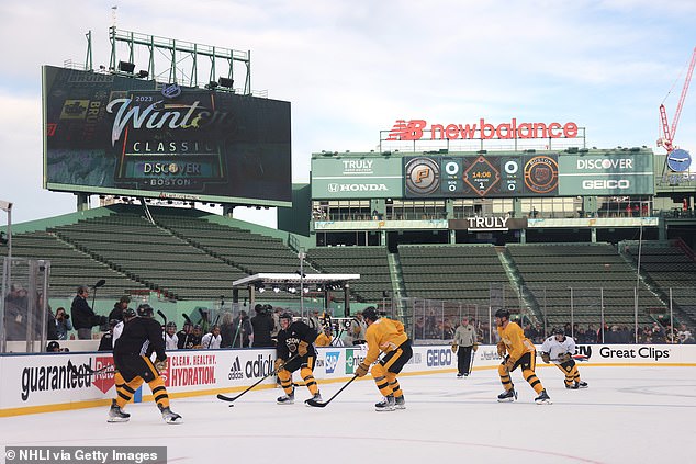 A general view of Charlie McAvoy #73 of the Boston Bruins playing the puck during practice for the NHL Winter Classic at Fenway Park on Sunday in Boston.