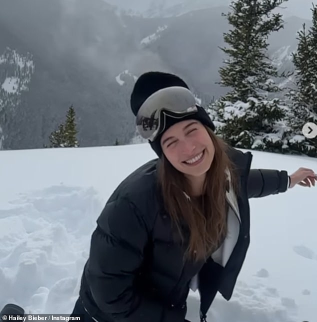 Making memories: Hailey bundled up in a North Face coat, beanie and ski pants for the slopes and looked like she was having the time of her life during her New Year's trip