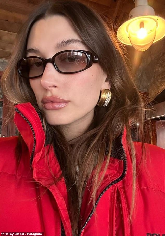 Winter chic: After the late-night party, the model kicked off 2023 in style in a red puffer jacket while heading out for lunch on Sunday