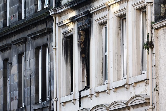 Smoke and fire damage to windows of the New County Hotel in Perth