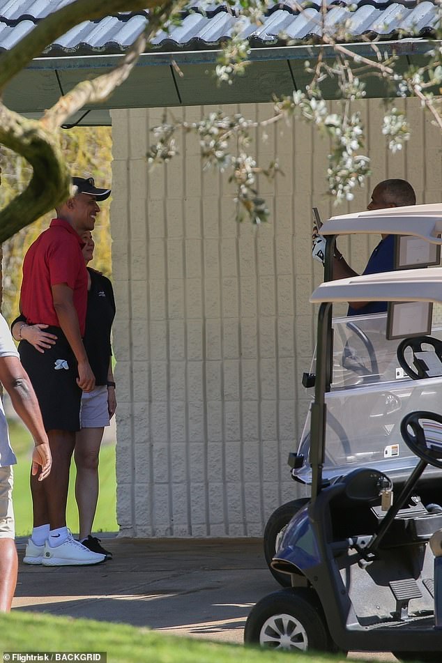 He brought a group of friends and smiled on the third hole before taking a selfie with an excited-looking employee.