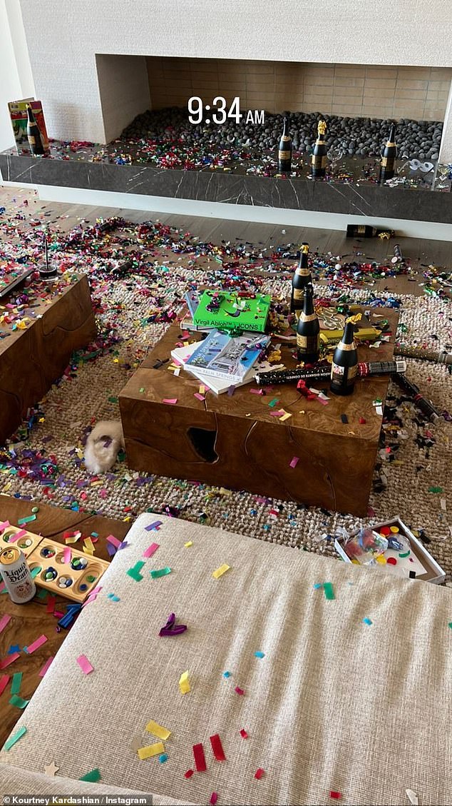 New Year!  The beauty revealed a look at the aftermath of the New Year's Eve festivities with confetti, hats and champagne littering the floor of her house.