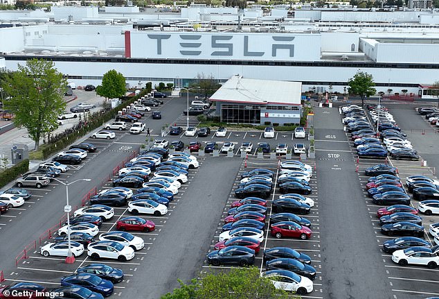 The missed growth targets come amid a period of turmoil for the automaker, which in June announced it would raise prices on all its car models by a steep $6,000, the second time it has done so in a matter of six months. .  Tesla cars sit parked in a lot at the Tesla factory in April