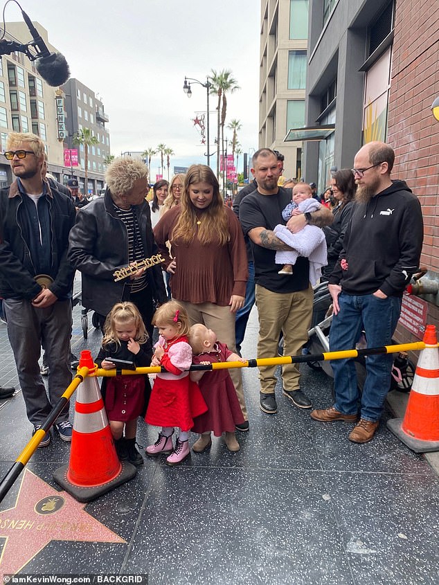 Family affair: Willem Broad, 34, and Bonnie Broad, 33, joined their father, with their daughter bringing along their adorable girls Poppy and Mary Jane (centre and far right)