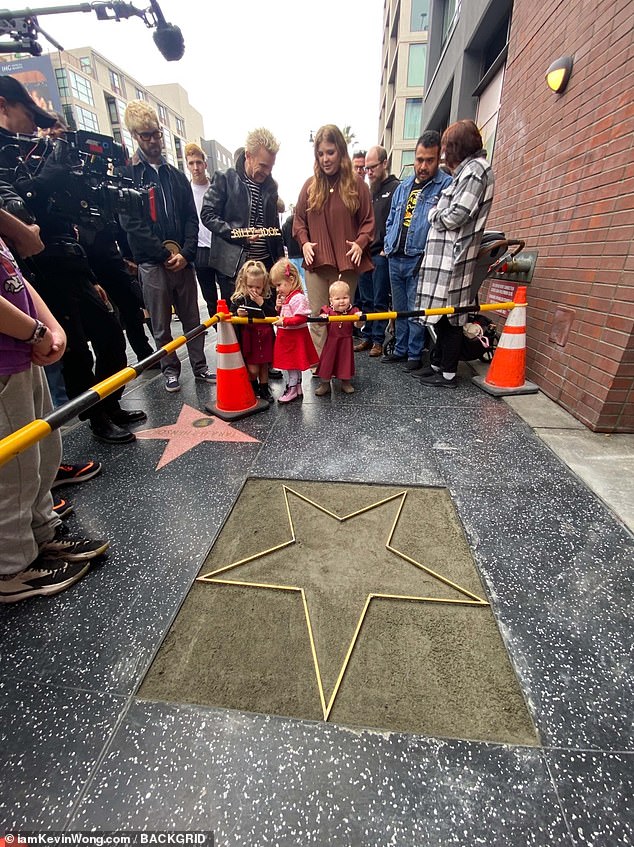 Gearing up: Idol, whose full name is William Michael Albert Broad, was in high spirits as he held up a nameplate, which will be embedded with the star emblem in a few days.