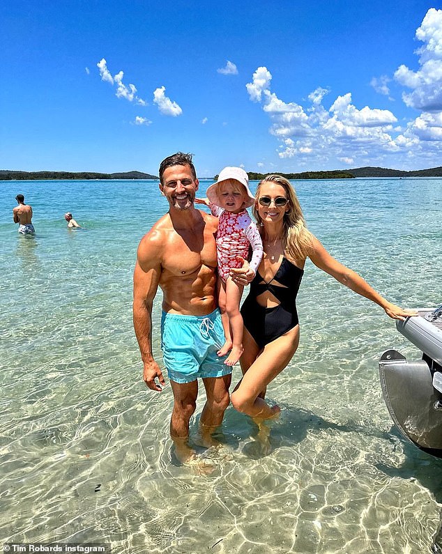 Tim said he then met a Bondi lifeguard halfway, who is believed to have rescued the other civilian.  Pictured: Tim with his wife Anna, 35, and his daughter Elle.