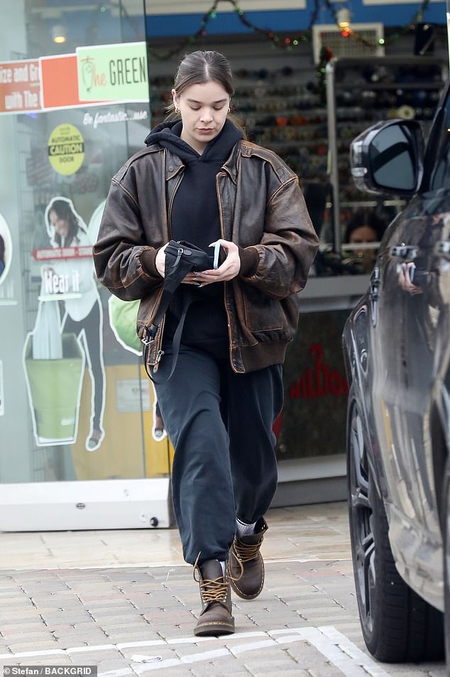 Hailee's Look: Steinfeld stepped out in a black hoodie under a brown leather jacket when she stepped out Monday afternoon