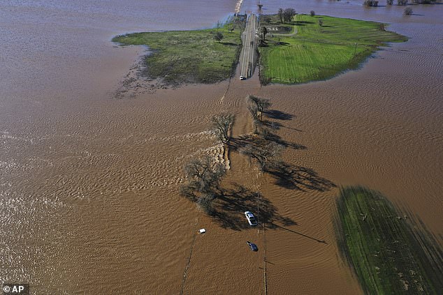 Three vehicles were seen submerged on Highway 99 in southern Sacramento County on Sunday.