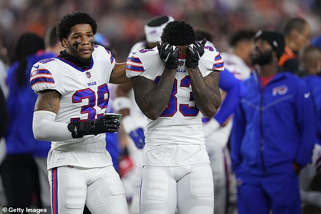 Cam Lewis and Siran Neal of the Buffalo Bills react to teammate Damar Hamlin's collapse