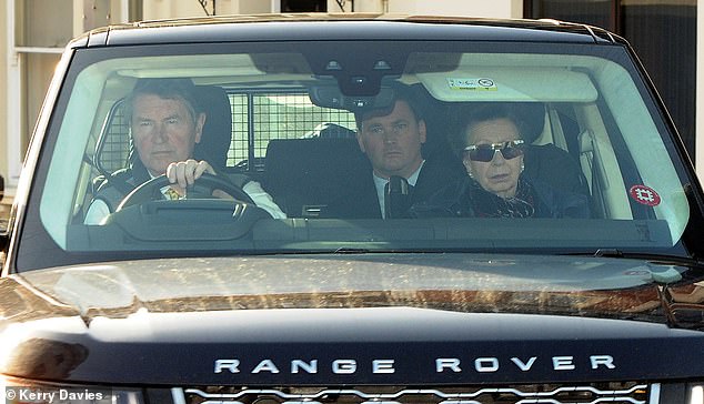 Princess Anne donned a pair of dark sunglasses as her husband, Tim Laurence, took her to the event.