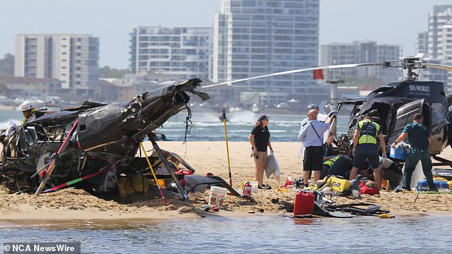 The two helicopters on a sandbank in Broadwater, near Sea World.  Image: News Media Network