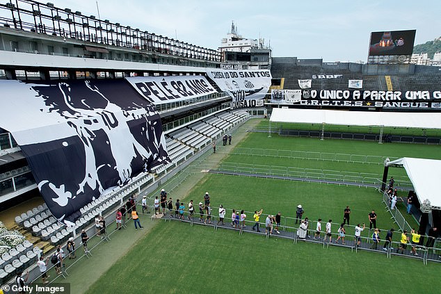 Men dressed in Santos tracksuits carried Pelé's coffin into the stadium on Monday morning.