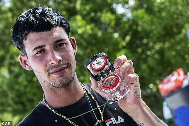 Jorge Yunier Cepa Sánchez showed a compass that he used to help guide migrants to Florida