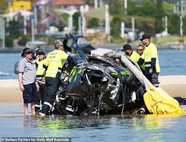 Four people died in a terror helicopter crash on Monday after two Sea World planes collided on the Gold Coast (pictured, wreckage)