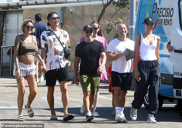 Jason Oppenheim proved he's close friends with his brother's ex-girlfriend Tina Louise as he walked with her on Bondi Beach alongside girlfriend Marie-Liu Nurk on Tuesday.