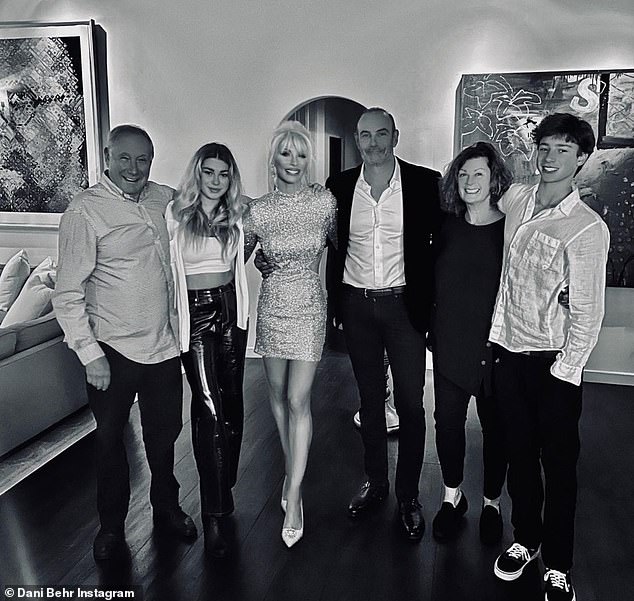 Holiday: The TV star posed with his family and captioned the image: 