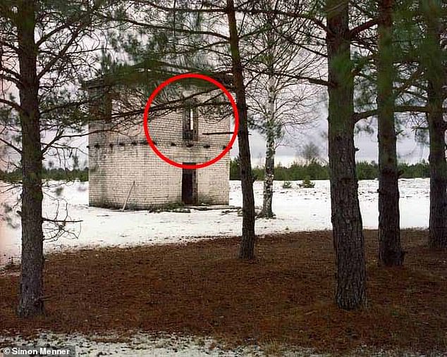 The sniper was in disguise on the second floor of the abandoned building.