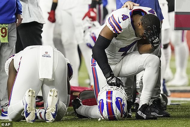 Bills players are seen praying for their 24-year-old teammate after he went into cardiac arrest