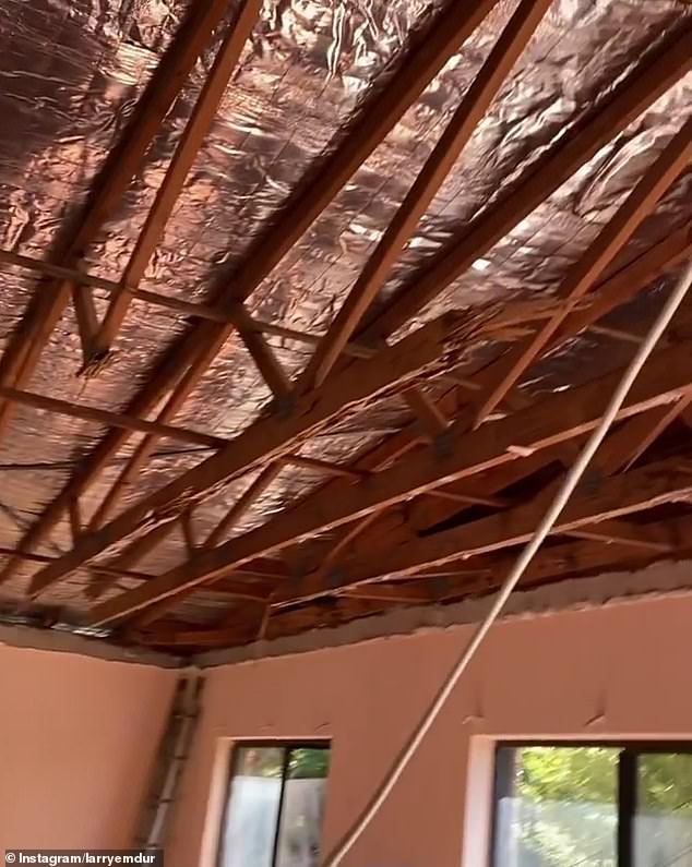 Missing parts: In footage from earlier this month, Larry showed broken wooden boards on the property's floor before moving the camera up to the roof, which was removed, leaving only the aluminum foil insulation.