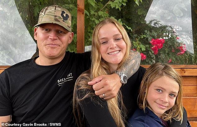 But despite having an operation to remove the cancerous tumour from his penis, he was given the crushing news the cancer had spread and he may only have a year to live (Pictured: Mr Brooks with his daughter Camren, 15, and son Jorje, 10