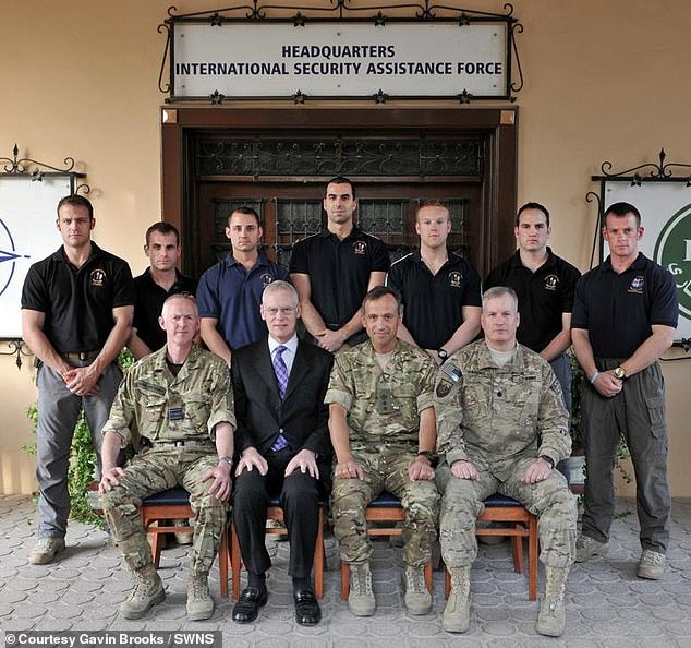 Mr Brooks (pictured in the back row, first on the left) was being sent for an operation in January this year where he had part of his penis removed