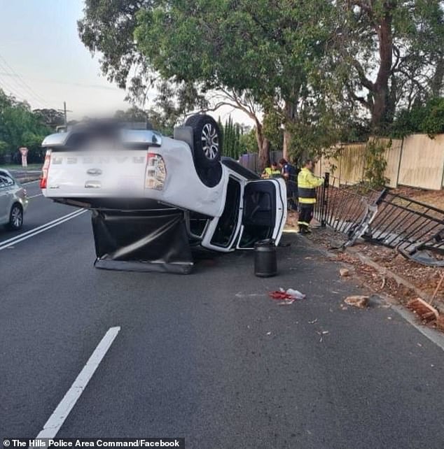 The extraordinary photos show the vehicle upside down with debris strewn across the road and a sidewalk guardrail fence collapsed from the impact.