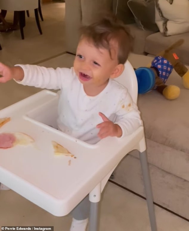 Number One Fan: Earlier in the day, Perrie had also shared a sweet video of Axel pointing at the TV and cheering as he watched his dad Alex play soccer from his high chair.