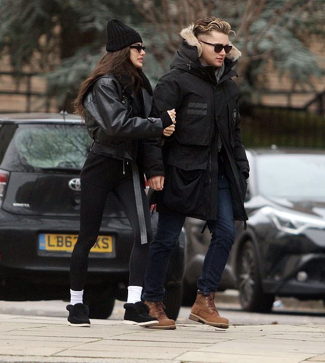 Beloved: The former Strictly pro, 28, bundled up in a black anorak and jeans, while his model partner, 27, looked dapper in a leather jacket and dark gray beanie