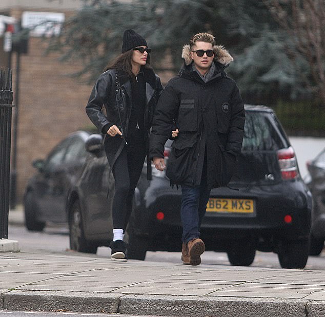 Cute: Each donning a pair of sunglasses, the couple certainly looked cozy as they held hands and linked arms during the outing