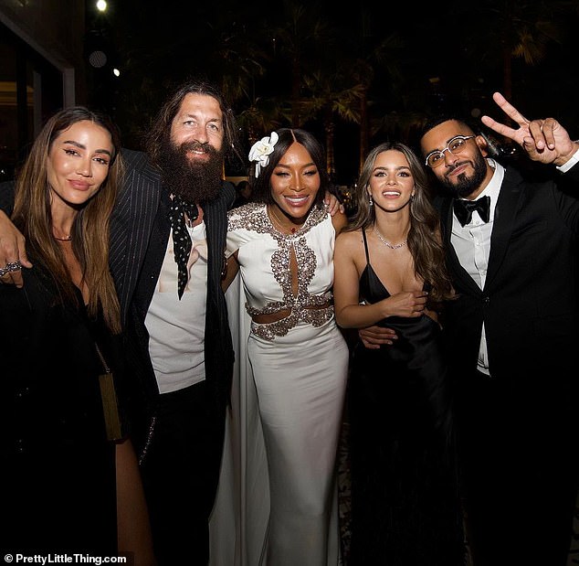 Couple: Umar, joined by his fiancée Nada Adelle (second from right) rocked a classic black tuxedo and crisp white shirt for the festivities.