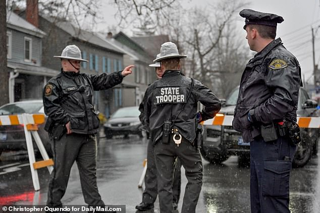 Pennsylvania State Troopers surround the Monroe County Courthouse in Stroudsburg Tuesday morning before Bryan Kohberger's appearance.