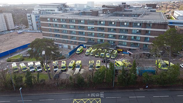 Ambulances wait outside Portsmouth Hospital due to shortages of rooms as patients are forced to sit inside the vehicles for hours