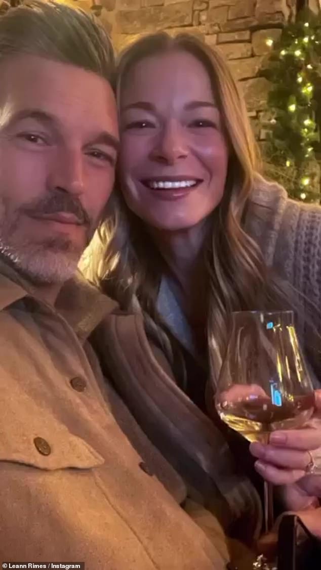 Warm and cozy: She shared several selfies of her and her husband rosy-cheeked in the snow, then enjoying white wine by the fireplace