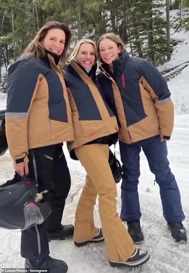 Coincidence: Later, she also posted a photo with friends, all dressed in matching jackets, before taking a ride on snowmobiles.