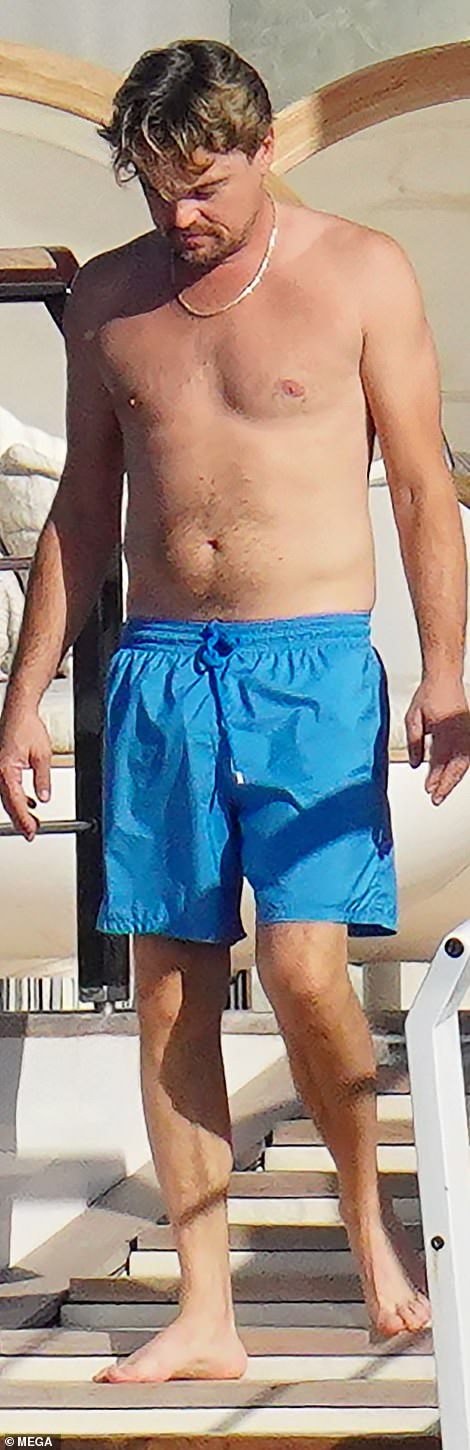 Sunbathing!  The 48-year-old Oscar winner showed off his shirtless body as he sunbathed aboard a luxury yacht.