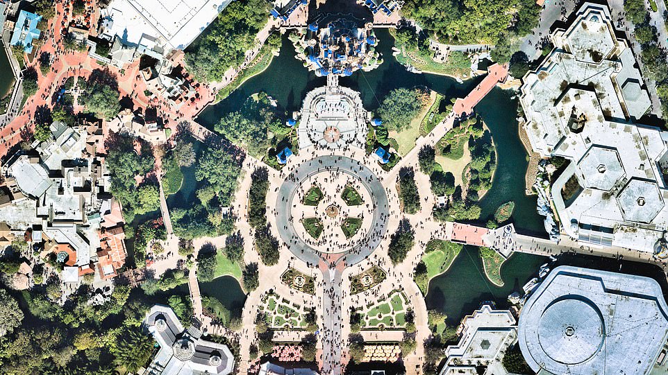 Over our heads, hundreds of satellites orbit the earth, every 90 minutes, traveling at 27,000 kilometers per hour and taking more than four million photographs a day.  Pictured: World of Disney with guests streaming