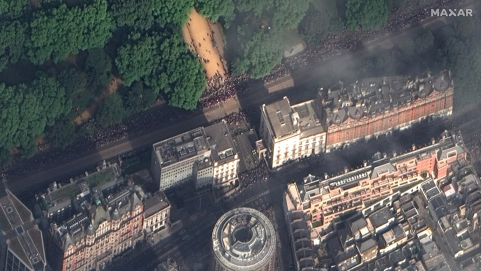 Whether they are capturing the natural world or photographing humanity, the images reveal planet Earth in a different light.  Pictured: The Queen's funeral: crowds in Hyde Park and Knightsbridge