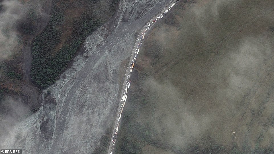 Trucks and cars waiting in a traffic jam near the Russian border with Georgia