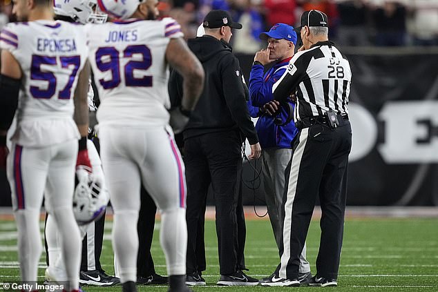 Head Coach Sean McDermott of the Buffalo Bills and Head Coach Zac Taylor of the Cincinnati Bengals speak during their game suspension following the injury to Buffalo Bills' Damar Hamlin #3 at Paycor Stadium