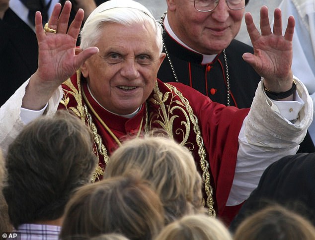 Pope Benedict XVI, pictured here waving to crowds in 2006, died on New Year's Eve at the age of 95.